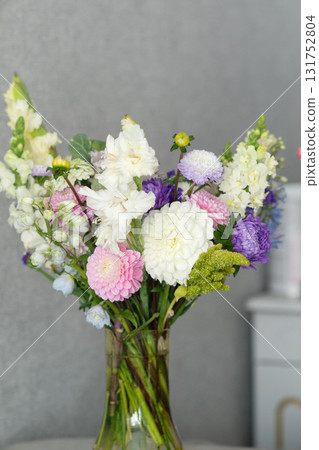 Elegant vase arrangement of colorful blooms with white, pink, and purple flowers. Teacher's Day in Uzbekistan 131752804