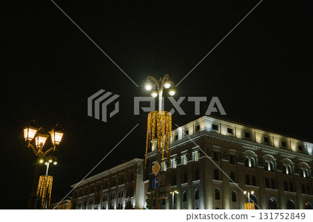 Illuminated street lamps and building at night 131752849