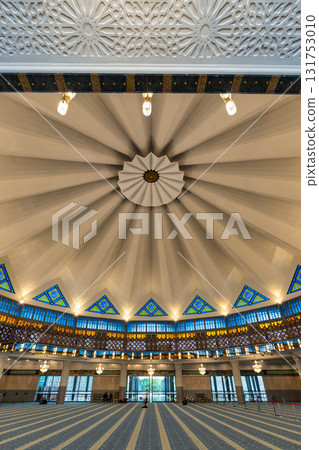 Masjid Negara National Mosque prayer hall interior with dome and stained glass, Kuala Lumpur, Malaysia. 131753010