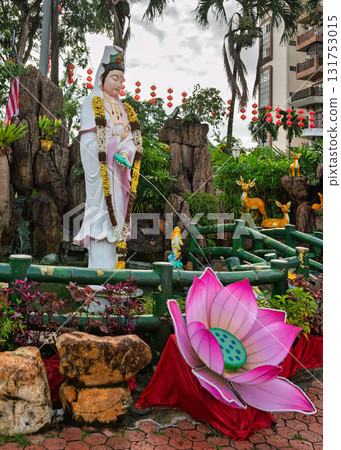Festive Guanyin statue, red lanterns, and lotus at Thean Hou Temple, Kuala Lumpur, Malaysia. Festive Guanyin statue, red lanterns, and lotus at Thean Hou Temple, Kuala Lumpur, Malaysia. 131753015