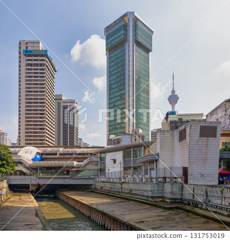 View of Kuala Lumpur skyline from Klang River, featuring KL Tower, Bank Muamalat, Wisma Lee Rubber, and LRT station, Malaysia 131753019