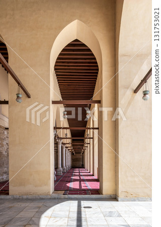 Sunlit Arches, Columns, and Prayer Rugs in the Historic Mosque of al-Zahir Baybars, Cairo, Egypt. 131753021