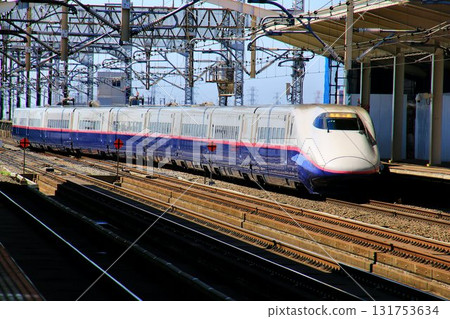 Heading towards Mutsu... The Tohoku Shinkansen E2 Series Shinkansen train entering Oyama Station Heading towards Mutsu... The Tohoku Shinkansen E2 Series Shinkansen train entering Oyama Station 131753634