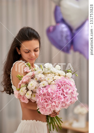 female hands holding bouquet flowers. Gift on the 8 march or valentines day. pink hydrangea female hands holding bouquet flowers. Gift on the 8 march or valentines day. pink hydrangea 131753828