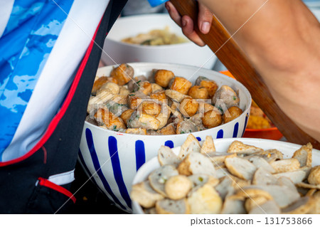 Assorted Fish Balls and Fried Fish Cakes in Large Bowl at Thai Street Food Stall Assorted Fish Balls and Fried Fish Cakes in Large Bowl at Thai Street Food Stall 131753866
