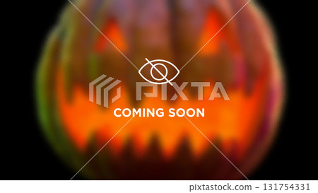 Blurred glowing Halloween pumpkin with coming soon text over it. Collage art 131754331