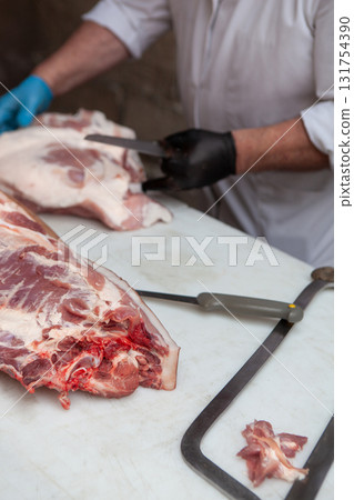 The butcher gestures on his block 131754390