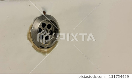 A close-up of an old bathtub drain A close-up of an old bathtub drain 131754439