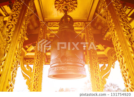 Symbols of Buddhism. Bells. South-Eastern Asia. Details of buddhist temple 131754920