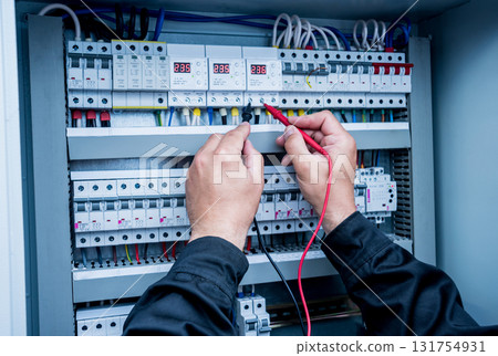 Electrical measurements with multimeter tester. Electrical background. 131754931