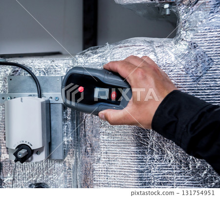 Electrical measurements with multimeter tester. Modern Industrial background.  131754951