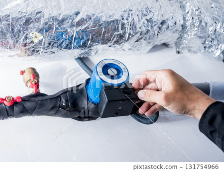 Ventilation cleaning. Specialist at work. Repair ventilation system  131754966