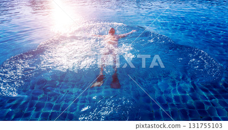 Young athletic man swimming in the swimming pool Young athletic man swimming in the swimming pool 131755103