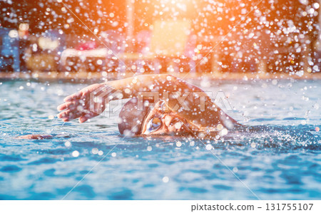 Young athletic man swimming in the swimming pool Young athletic man swimming in the swimming pool 131755107