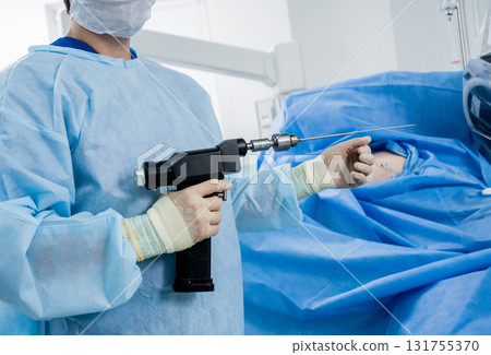 Arthroscope surgery. Orthopedic surgeons in teamwork in the operating room Arthroscope surgery. Orthopedic surgeons in teamwork in the operating room 131755370