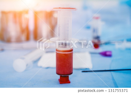 Platelet-Rich plasma preparation. Plasma in syringe. Centrifuge. 131755371