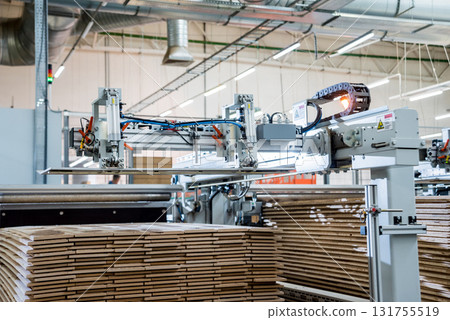 Production line of the wooden floor factory. CNC automatic woodworking machine. Production line of the wooden floor factory. CNC automatic woodworking machine. 131755519