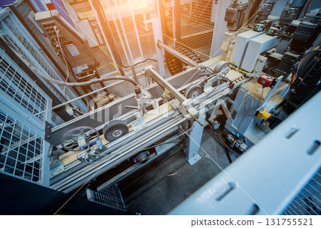Production line of the wooden floor factory. CNC automatic woodworking machine. 131755521