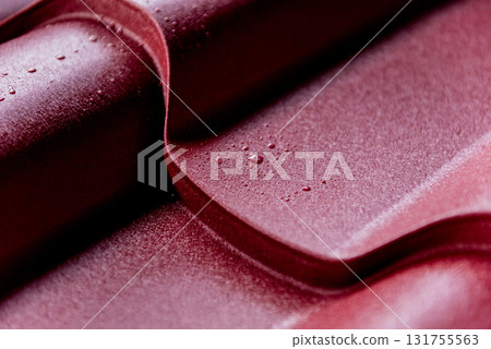 Red metallic roof tiles background with drops of water. Red metallic roof tiles background with drops of water. 131755563