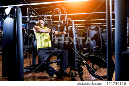Disabled man training in the gym of rehabilitation center 131756126