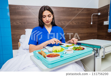 Tray with breakfast for the young female patient. Tray with breakfast for the young female patient. 131756200