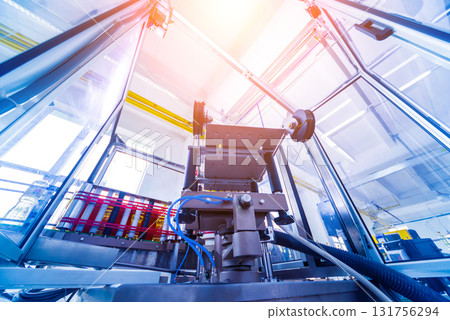 Automatic labeling machine during operation. Factory for the production Automatic labeling machine during operation. Factory for the production 131756294