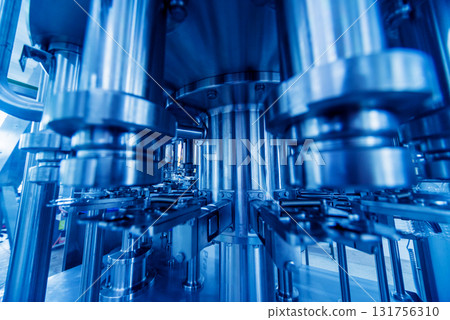 Bottling line of sunflower oil in bottles. Vegetable oil production plant. Bottling line of sunflower oil in bottles. Vegetable oil production plant. 131756310