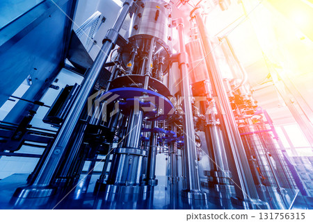 Automatic filling machine pours water into plastic PET bottles. Automatic filling machine pours water into plastic PET bottles. 131756315