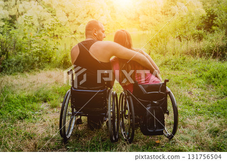 Handicapped couple resting in the forest near lake. Handicapped couple resting in the forest near lake. 131756504