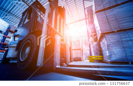 Forklift loader in storage warehouse ship yard. Distribution products.  131756637