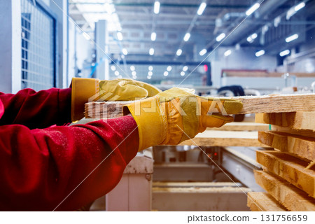 Carpenter with fibreboards at furniture factory workshop. Woodworking industry Carpenter with fibreboards at furniture factory workshop. Woodworking industry 131756659