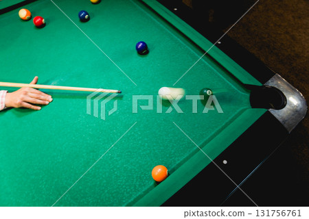 Young man trying to hit the ball in billiard. Young man trying to hit the ball in billiard. 131756761