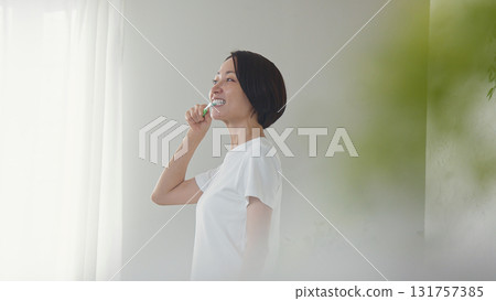 Tooth brushing woman image Tooth brushing woman image 131757385