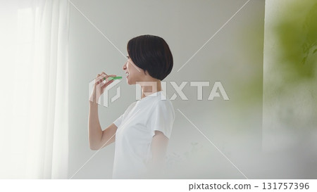 Tooth brushing woman image 131757396
