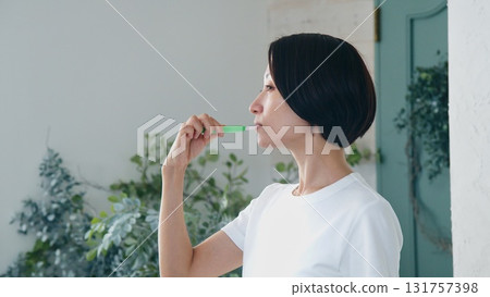 Tooth brushing woman image 131757398