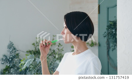 Tooth brushing woman image Tooth brushing woman image 131757419