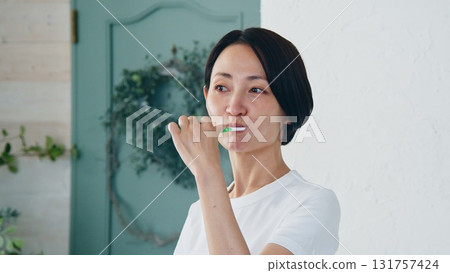 Tooth brushing woman image Tooth brushing woman image 131757424