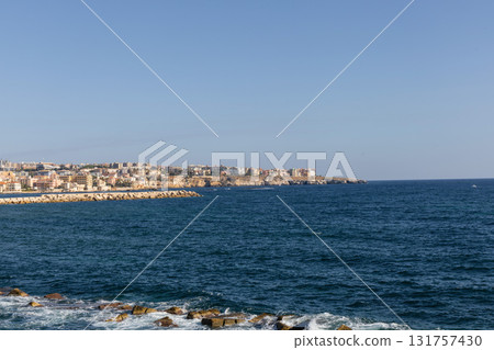 Syracuse skyline along sunlit Mediterranean seaside promenade 131757430