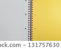 Spiral bound lined notebook with yellow page 131757630