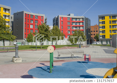 Colorful modern houses with apartments and playground Colorful modern houses with apartments and playground 131757657