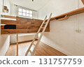 An elegant, modern interior showcasing wooden elements, a ladder, and clean lines. Bright natural light enriches the minimalist design. 131757759