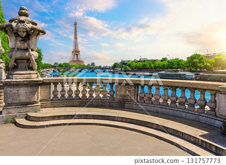 Elegant view from Alexandre III Bridge over Seine river, with sculptures and Eiffel Tower behind, Paris, France 131757773