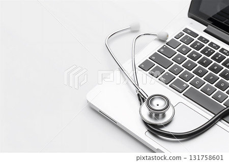 A stethoscope and laptop computer symbolize the fusion of medicine and technology 131758601