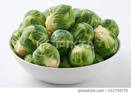 Fresh Brussels sprouts in a white bowl ready for cooking or serving 131758776