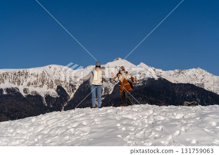 Mountains Snow Women Winter Recreation: Alpine Fun, Sunny Day, Snowy Peak Mountains Snow Women Winter Recreation: Alpine Fun, Sunny Day, Snowy Peak 131759063