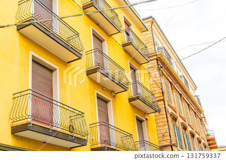 Old Italian balcony street in Rimini city Italy. Building architecture colorful houses in center square historical touristic place Old Italian balcony street in Rimini city Italy. Building architecture colorful houses in center square historical touristic place 131759337