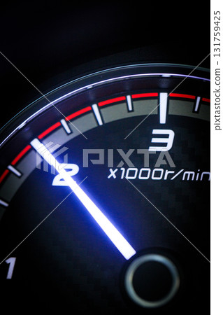 Close-up of a diesel truck's dashboard and tachometer. It represents the power and durability of a work vehicle, with a clear focus on the round engine meters. 131759425