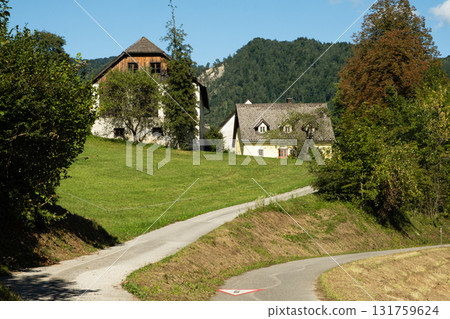 Traditional European Village with Charming Houses in Mountain Nature 131759624