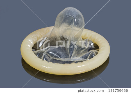 Condom on dark surface 131759666