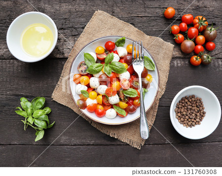 Vegetarian caprese antipasti salad with mozzarella, tomatoes, basil Vegetarian caprese antipasti salad with mozzarella, tomatoes, basil 131760308